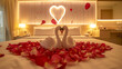 Beautiful hotel for honeymoon sweet.Swan couple put on honeymoon bed look like heart shape with rose petals for honeymoon lover.The staff hotel put yellow lighting in the room make romantic