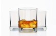 clear image showcasing three glasses—two empty and one filled with golden whiskey and ice