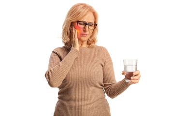 Poster - Middle aged woman with a toothache holding a glass of water