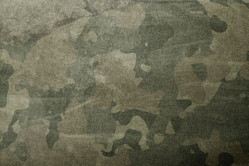 Wall Mural - texture of military dirty camouflage fabric. combat protective camouflage for background