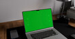 © Kaponia Aliaksei - Laptop place on room table, Green screen display, Close up monitor of notebook with mock up