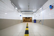 Empty clean car wash room with drainage device and open lifting gate