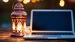 lantern and laptop on wooden table at night, blurred lights in the background, ramadan kareem concept
