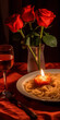 Candlelight dinner with spaghetti and roses