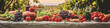 Still life of a bountiful harvest of fruits and vegetables in warm colors with a painterly style.