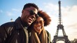 A happy African-American couple in center of Paris, against the backdrop of the Eiffel Tower. Tourists, Europe, Travel. A horizontal banner with copy space. The Layout Of The Postcard, Cover, Poster.