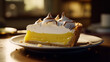 Still life of a slice of lemon meringue pie on a white plate with a blurry background.