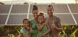 Fototapeta  - Happy family with solar panels at sunset