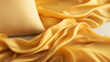 Close-up of golden silk satin fabric and pillow
