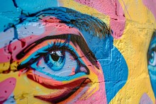 A Vibrant Mural On A City Wall Depicts A Womans Face In A Colorful Style