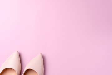 Wall Mural - Women's shoes on a pink background. Space for text