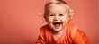 Smiling cute and smiling Caucasian little infant against background with large copy space. Perfect for advertisement.