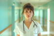© Simon - Portrait of a young female doctor in the hospital corridor.