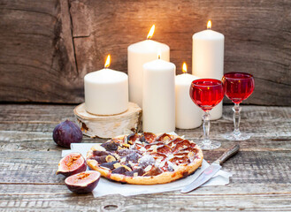 Wall Mural - Fig and Pecan Pie or tart, homemade pie crust with figs, brown sugar, butter, eggs and pecans filling, decorated with fresh figs and toasted pecan