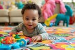 Adorable baby with curly hair enjoys playtime surrounded by vibrant toys indoors