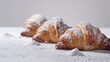 Croissants with light powdered sugar, studio shot.