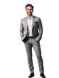 © Mario - A man in a grey suit stands with his hands in his pockets, smiling at the camera