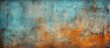 A close up of a vibrant blue and orange painting on a wooden wall. The artwork features natural landscapes with tints of electric blue and peach, creating a beautiful pattern of grassy fields