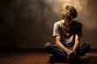 © Svetlana - a teenager sits on a dirty floor and is sad. stress and depression. lonely child is restructured.