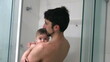 © Marco - Father in shower with baby infant son bathing