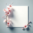Greeting card, invitation card Concept template. Empty white paper with sakura flower beside the paper 