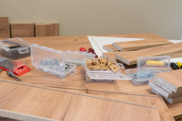 a scattered array of woodworking tools and materials on a wooden surface