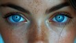  Close-up portrait of a woman with freckles on her face and eyelids