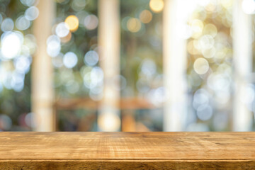 Poster - Empty wooden table with blurred bokeh lights in the background. Background concept with copy space for product display montage. High quality photo