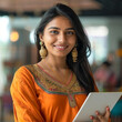 Smiling Hindu businesswoman 20-30 years old, active business woman against the background of her office