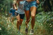 Energetic Joggers Embrace Nature on a Lush Green Trail