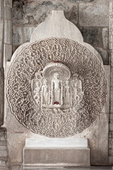 Wall Mural - Intricate architecture of Jain God statue in historic Ranakpur Jain temple, India.