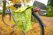 The light green bicycle pannier on a bike