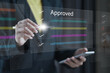© Montri - checklist and Approve concept. management approval. Businessman check electronic documents on digital documents and checklist approve, online evaluation of business on virtual interface, approval..