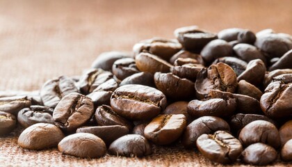 Wall Mural - coffee beans on brown background isolated