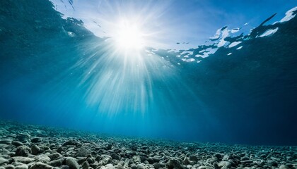 underwater blue sea background photo with with sun and sunlight shining under the sea