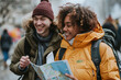 Joyful Young Couple Exploring City with Map on Winter Day