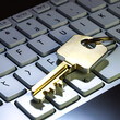 A gold key is placed on a keyboard. The key is positioned in the middle of the keyboard, with the letters F and K on either side. Concept of security and protection