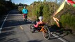 © Robert Peak - Elderly mother and mature daughter riding e-bikes on a park trail. Mother is on a recumbent electric e bike.