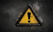 Warning sign with a triangular frame, exclamation mark and paint splatter effect on a black background, danger and caution.