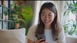 blogging, technology and videoblog concept - happy smiling asian woman or blogger recording video blog of smartphone at home