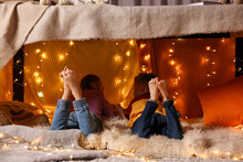 Kids In Decorated Play Tent At Home, Back View