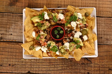 Wall Mural - mexican food tacos guacamole jalapeno burritos quesadillas nacho tortilla tex-mex cuisine healthy food spiced tomato and onion