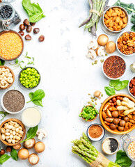 Wall Mural - Vegan food background with empty space. Plant protein., vegetarian nutrition sources. Healthy eating, diet ingredients: legumes, beans, lentils, nuts, soy milk, tofu, cereals, seeds 