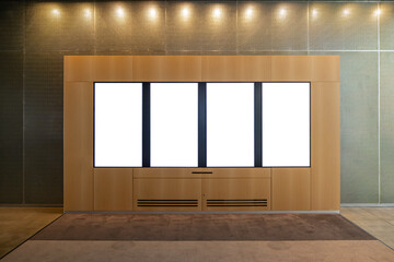 Wall Mural - Four Indoor modern Display Panel with Blank Screens in a Wooden Interior. Blank white vertical panels for showcasing digital media and advertisements in an urban building's hall.