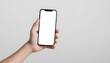 Close up of woman hand holding modern smart phone mockup. New modern black frameless smartphone mockup with blank white screen