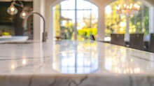 Close Up Photo Of Contemporary Kitchen Island With Marble Table Top With Kitchen Blurry Loose Focal Of A Giant Arch Windows Background : Generative AI