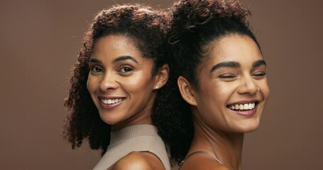 Poster - Women, face and together for beauty in studio with smile, solidarity and glow on skin by brown background. Girl friends, people or model with skincare, health and facial cosmetics with natural makeup