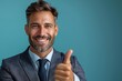 Businessman in suit giving thumbs up.