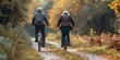 Two older people are riding bicycles down a path