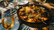 Spanish Paella dish on a table a Spain specialty rice dish originally from the Valencian Community